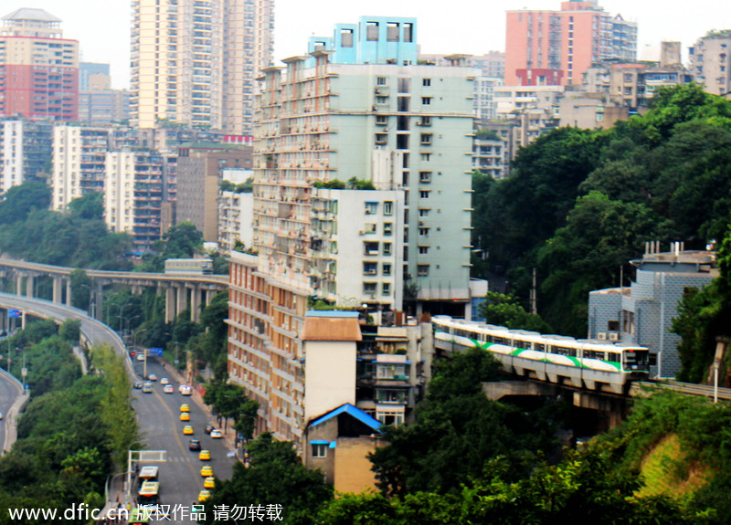 Light rail pass through building in Chongqing