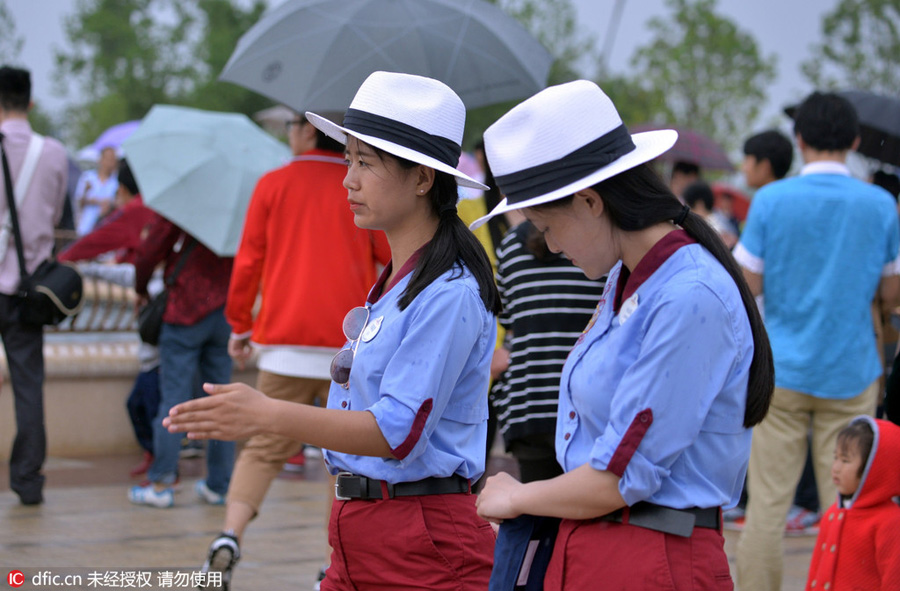 Disney Town staff members greet visitors with smiles