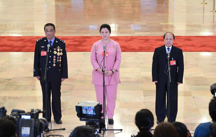 Delegates pick up questions at the Great Hall of the People