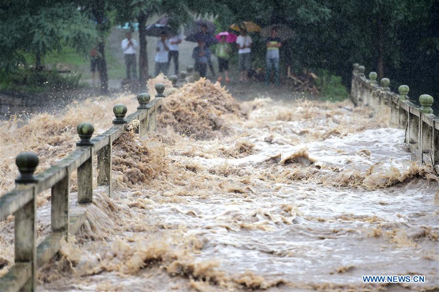 China warns of geological disasters as rainstorm triggers another orange alert