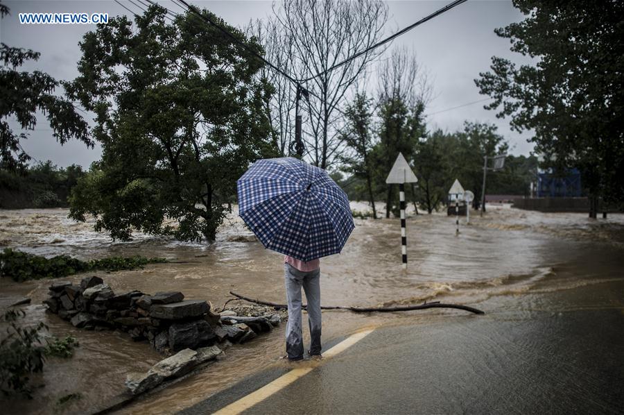 China warns of geological disasters as rainstorm triggers another orange alert