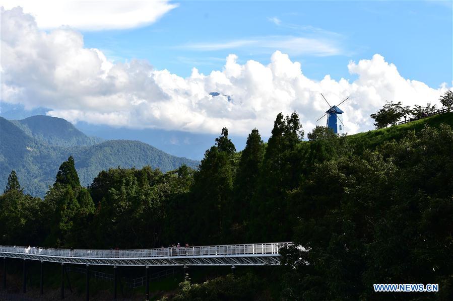 People enjoy scenery at high altitude sight-seeing footpath in Taiwan