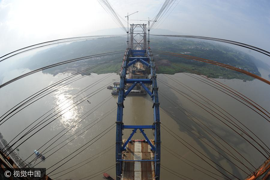 China inches closer to completing world's first 'rail above road bridge'