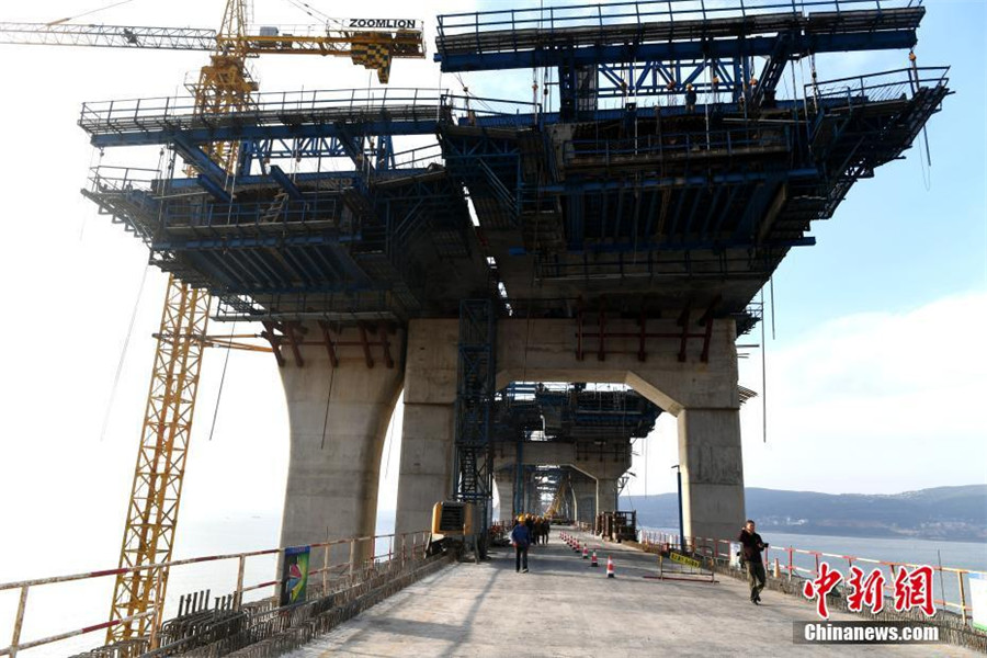 China's first cross-sea rail-road bridge takes shape