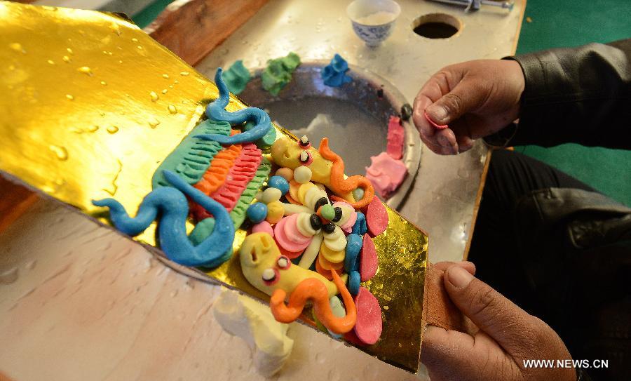 Craftsmen make butter sculptures in China's Tibet