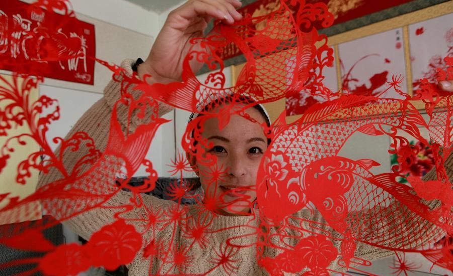 Paper cutting develops into cultural industry NE China