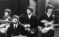 Early George Harrison guitar leads Beatles memorabilia auction