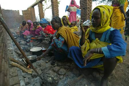 A file photo shows displaced Sudanese women preparing tea at a hospital at Golo, west Darfur.[Reuters]