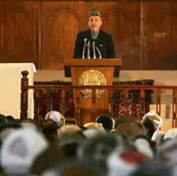 Afghan President Hamid Karzai talks to members of the Loya Jirga, or traditional grand council, in Kabul May 8, 2005. Karzai summoned hundreds of representatives from across Afghanistan for talks that will include the sensitive issue of a strategic partnership with the United States, a presidential official said on Thursday. Photo by Ahmad Masood/Reuters