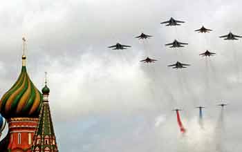 Russian fighters fly over St. Bazil's Cathedral in Red Square in Moscow during the military parade May 9, 2005. [Reuters]