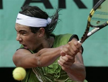 Spain's Rafael Nadal returns the ball to compatriot David Ferrer during their quarterfinals match of the French Open tennis tournament at the Roland Garros stadium, Tuesday May 31, 2005 in Paris. Nadal won 7-5, 6-2, 6-0. ( AP 