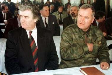 An undated file photo of Former Bosnian Serb leader Radovan Karadzic, left and his military commander Gen. Ratko Mladic, right, at Mt. Jahorina, Bosnia.