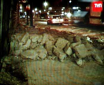 A video image shows fallen wall in a street after an earthquake hit Iquique, about 1845km (1146 miles) north of Santiago in Chile June 13, 2005. A powerful 7.9-magnitude earthquake shook Chile's northern mining region on Monday, causing at least eight deaths, cutting power and driving residents from their homes in the port city of Iquique. The quake was also felt in the Bolivian capital La Paz and in southern Peru. 