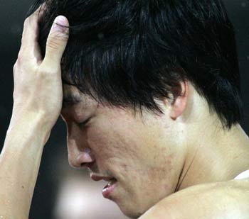 China's Olympic champion Liu Xiang reacts after placing second in the men's 110 metres hurdles race at the Zurich Golden League meeting in Switzerland August 19, 2005. Dominique Arnold of the U.S. won the race ahead of Liu and third-placed