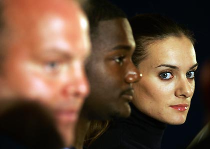 Women's pole vault world champion Yelena Isinbayeva of Russia (R), world champion of the 100 meters and 200 metres Justin Gatlin of the U.S. (C) and the shot put world champion Adam Nelson of the U.S. attend a news conference in Monte Carlo September 8, 2005. The IAAF World Athletics Final will takes place in Monaco on Friday and Saturday.