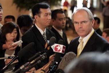 Christopher Hill (R), U.S. Assistant Secretary of State for East Asian and Pacific Affairs and top U.S. negotiator for the six-party talks, speaks to journalists before continuation of talks in Beijing September 16, 2005.