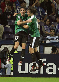 Artmedia Bratislava's Balazs Borbely (L) and team mate Jan Kozak celebrate their goal against Porto during their Champions League Group H soccer match at Dragon stadium in Porto, northern Portugal, September 28, 2005. 