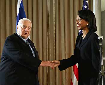 Israeli Prime Minister Ariel Sharon (L) shakes hands with U.S. Secretary of State Condoleezza Rice before their meeting in Jerusalem November 14, 2005. Rice met Sharon on Monday in a new push to revive peace moves stalled by violence.