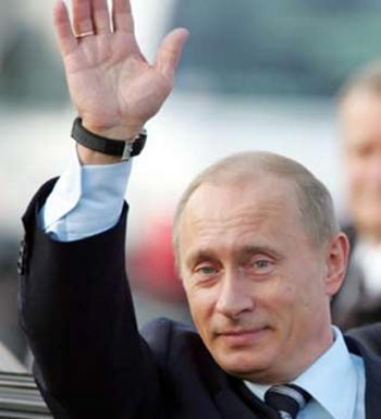 Russian President Vladimir Putin waves upon arrival at Haneda international airport in Tokyo November 20, 2005. 