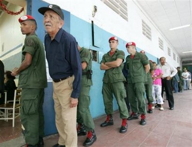 Venezuelan soldiers 
 and civilians line up to vote at a poll station in Caracas, Venezuela, Sunday, Dec. 4, 2005.