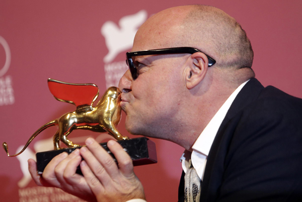 Italian director Gianfranco Rosi wins Golden Lion Award