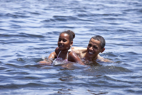 Obama swims, takes boat ride during Gulf Coast vacation