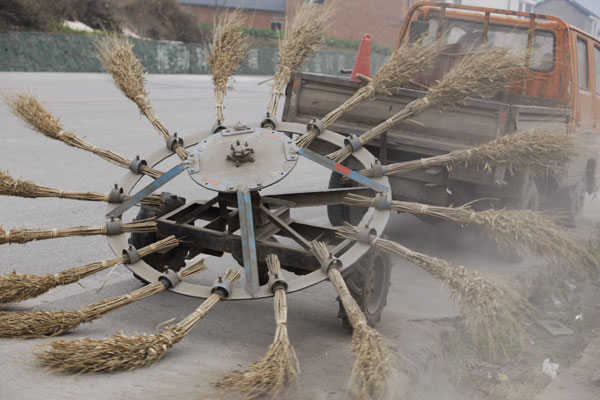 Road cleaner creates dust storm