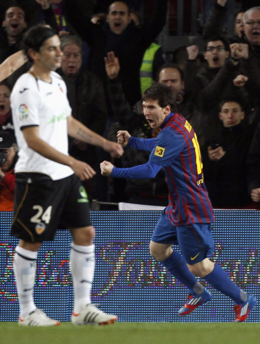 Messi scores four as Barca thrashes Valencia