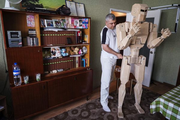 Crane operator creates wooden robot