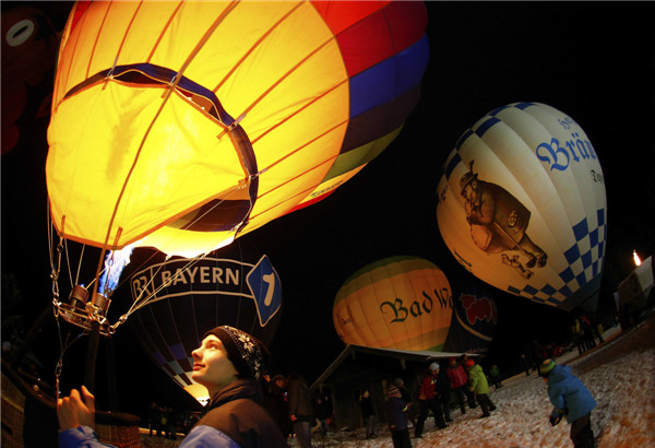 People light up hot air balloons in Germany